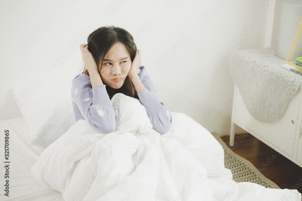 unhappy depressed and worried suffering sad young pretty asian woman sitting alone on bed at home in morning, dramatic, depression, unexpected pregnancy, emotion, broken heart and life problem concept unhappy depressed and worried suffering sad young pretty asian woman sitting alone on bed at home in morning, dramatic, depression, unexpected pregnancy, emotion, broken heart and life problem concept