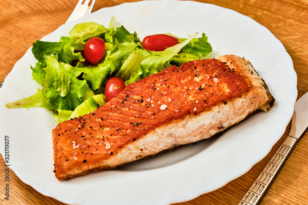 Cooked salmon fillet on plate Cooked salmon fillet on plate