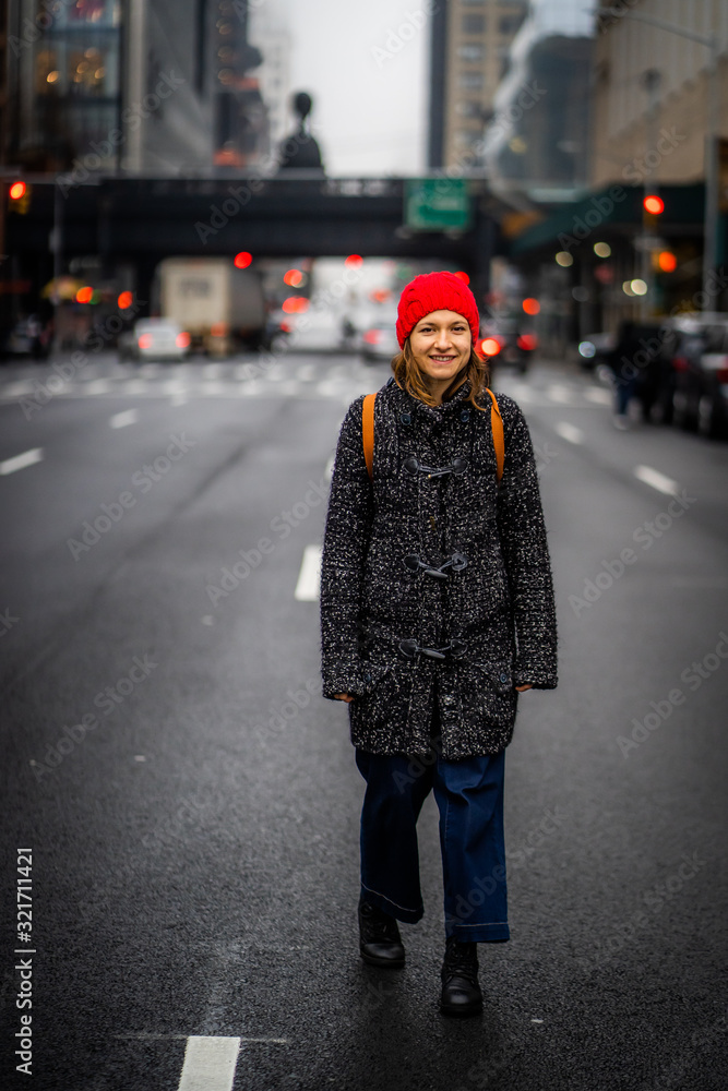 Tourist girl walking in the street of manhattan view, NYC, USA