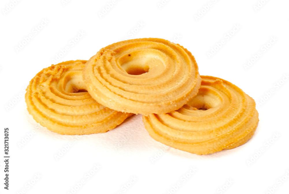 Round spritz shortbread isolated on white background. Danish butter cookies on white. Round spritz shortbread isolated on white background. Danish butter cookies on white.