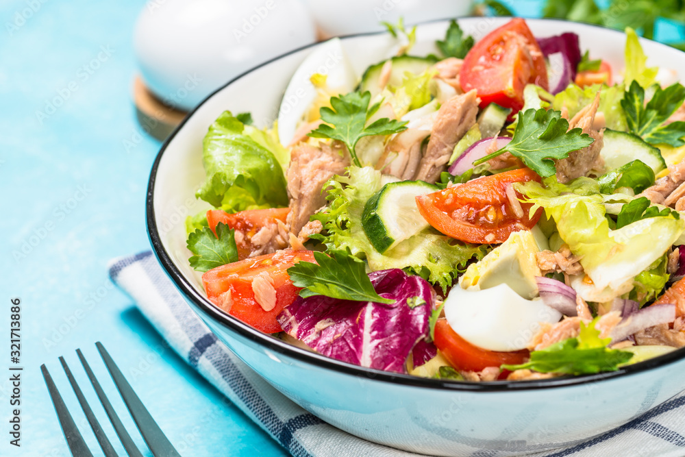 Tuna salad with green leaves, eggs and vegetables. Tuna salad with green leaves, eggs and vegetables.