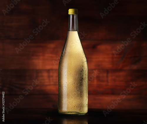 full bottle of cider with pears