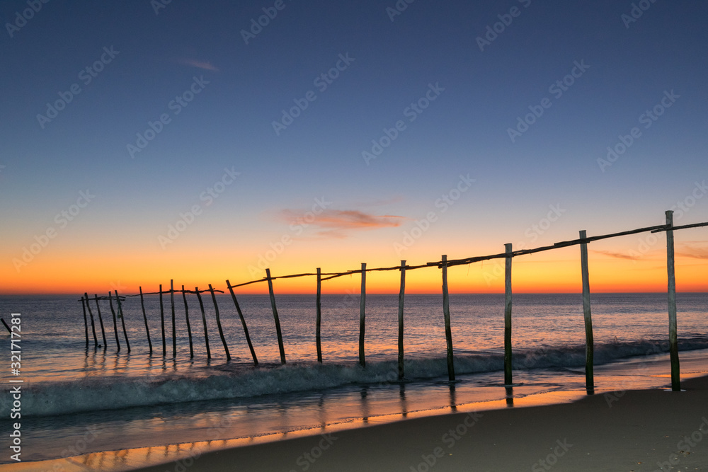 Naklejka premium Magnificent long exposure sunset on the beach and sea.