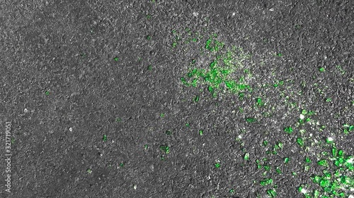 Wallpaper Mural shards of broken green glass from the beer bottle crumbled on the black asphalt and shimmered beautifully like emeralds under the red-hot rays of the bright daylight sun Torontodigital.ca