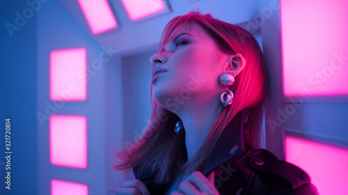 Futuristic style portrait in blue and purple light.