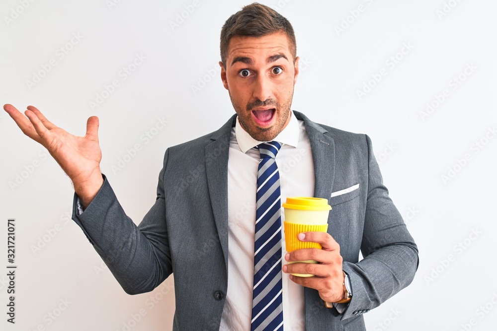 Young handsome business man drinking take away coffee over isolated background very happy and excited, winner expression celebrating victory screaming with big smile and raised hands Young handsome business man drinking take away coffee over isolated background very happy and excited, winner expression celebrating victory screaming with big smile and raised hands