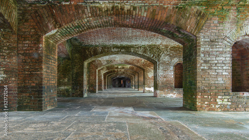 Series of arches with old bricks within Fort Jefferson at Dry Tortugas National Park near Key West, Florida. Old achitecture. Background concept.