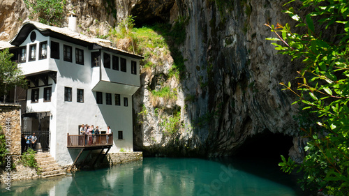BLAGAJ, BOSNIA - April, 2019 : Blagaj Tekija house in cave near river. Blagaj is popular destination in Bosnia.