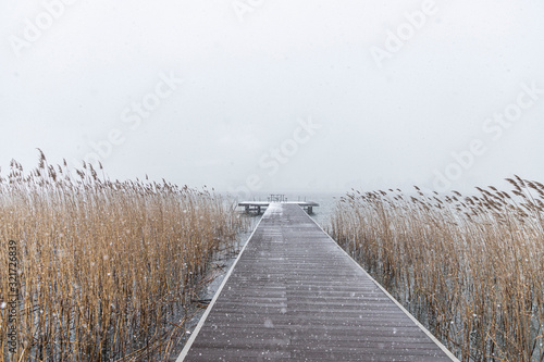 Fototapeta Naklejka Na Ścianę i Meble -  wooden walkway on sapanca lake in winter