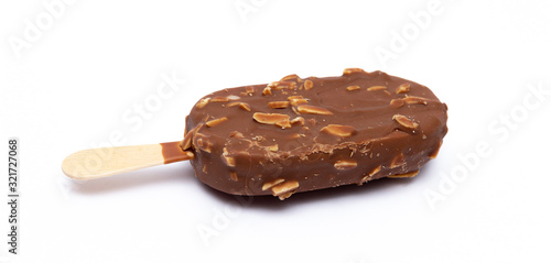 Chocolate ice cream with nuts on a stick. Isolated on a white background. Tasty dessert.
