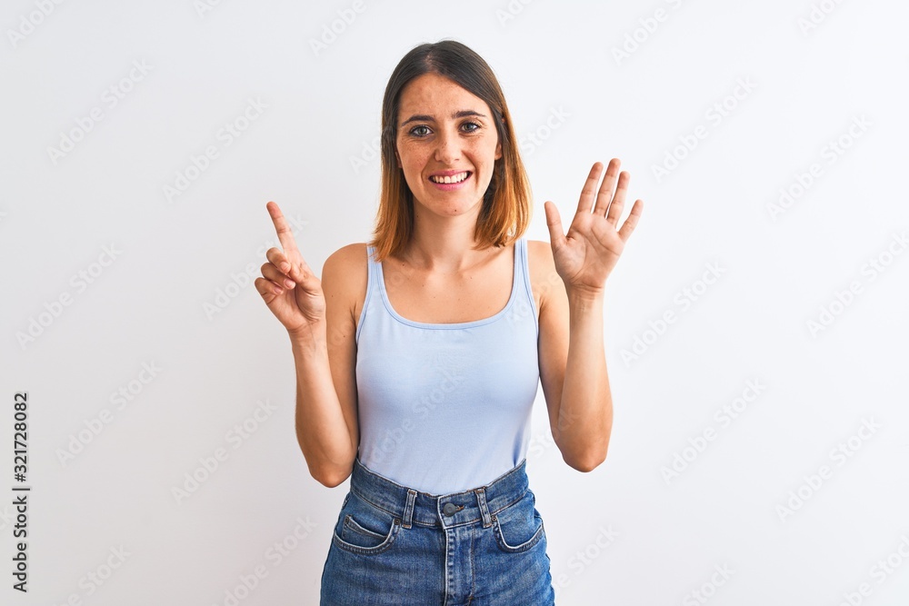 Beautiful redhead woman standing over isolated background showing and pointing up with fingers number six while smiling confident and happy. Beautiful redhead woman standing over isolated background showing and pointing up with fingers number six while smiling confident and happy.