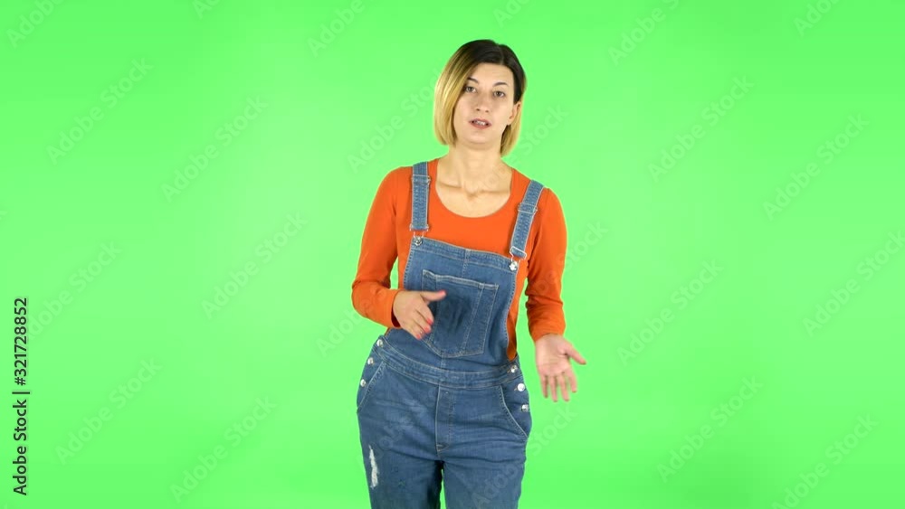 Girl claps her hands indifferently. Green screen Girl claps her hands indifferently. Green screen
