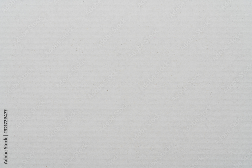Gray background from sheet of recycled cardboard. Close-up detail macrography view of abstract surface recycled eco-friendly carton material pattern background. Gray background from sheet of recycled cardboard. Close-up detail macrography view of abstract surface recycled eco-friendly carton material pattern background.