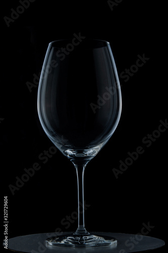 transparent glass wine glass on black background