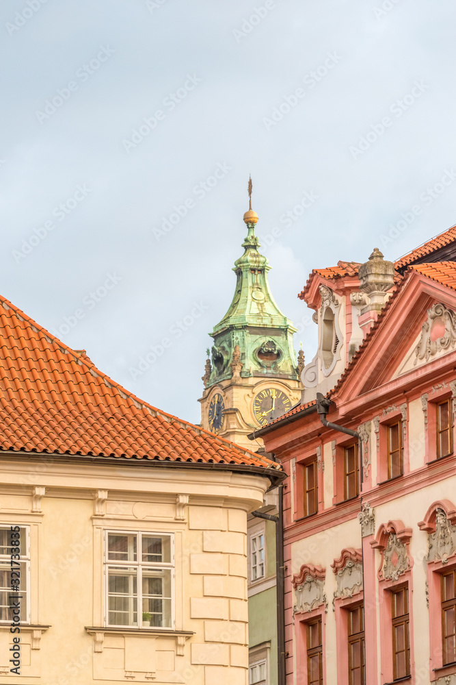 View of the top of old buildings with red roof and dramatic sky at Prague city Czech republic.