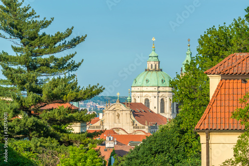 Top view to red roofs and green trees skyline of Prague city Czech republic.