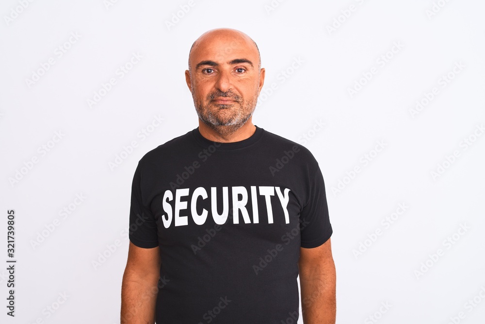 Middle age safeguard man wearing security uniform standing over isolated white background Relaxed with serious expression on face. Simple and natural looking at the camera. Middle age safeguard man wearing security uniform standing over isolated white background Relaxed with serious expression on face. Simple and natural looking at the camera.