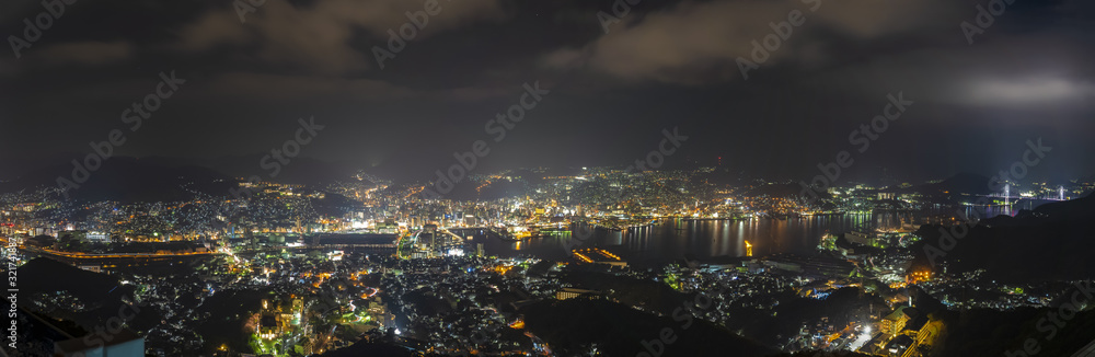 Naklejka premium Nagasaki city light up at night. Panorama nightscape from Mt Inasa observation platform deck. Famous beauty scenic spot in the world, the 10 ten million dollar night views. Nagasaki Prefecture, Japan