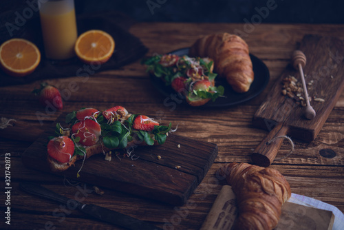 Healthy croissant for breakfast on dark background photo