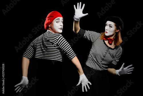 Two mimes and invisible wall. Pantomime show at circus photo