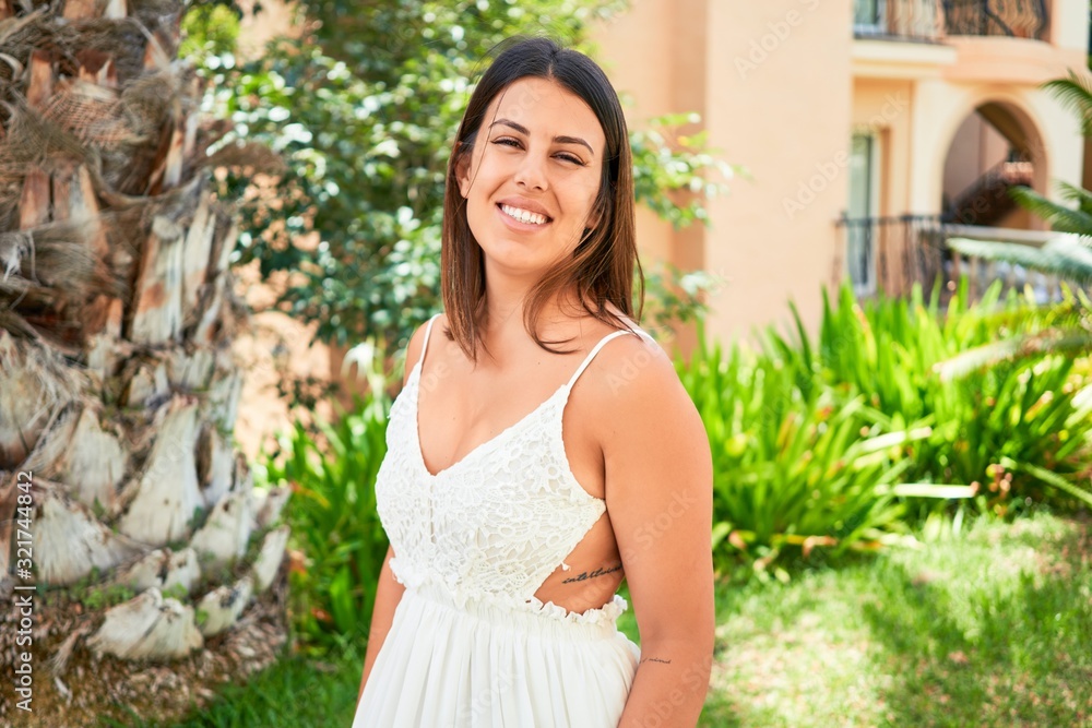 Young beautiful woman smiling happy enjoying sunny day of summer at hotel resort on holidays Young beautiful woman smiling happy enjoying sunny day of summer at hotel resort on holidays