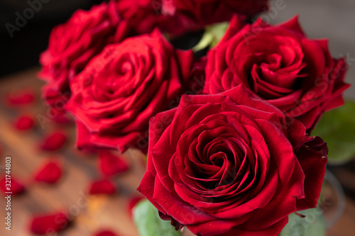 Red roses bunch on the moody background