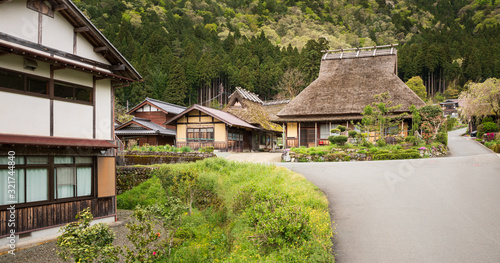 Fototapeta Naklejka Na Ścianę i Meble -  Traditional thatched roof house in small Japanese mountain village