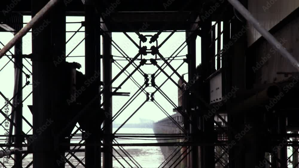 Tilt down from a close up of support structures to a view of South end Pier from below the deck Tilt down from a close up of support structures to a view of South end Pier from below the deck