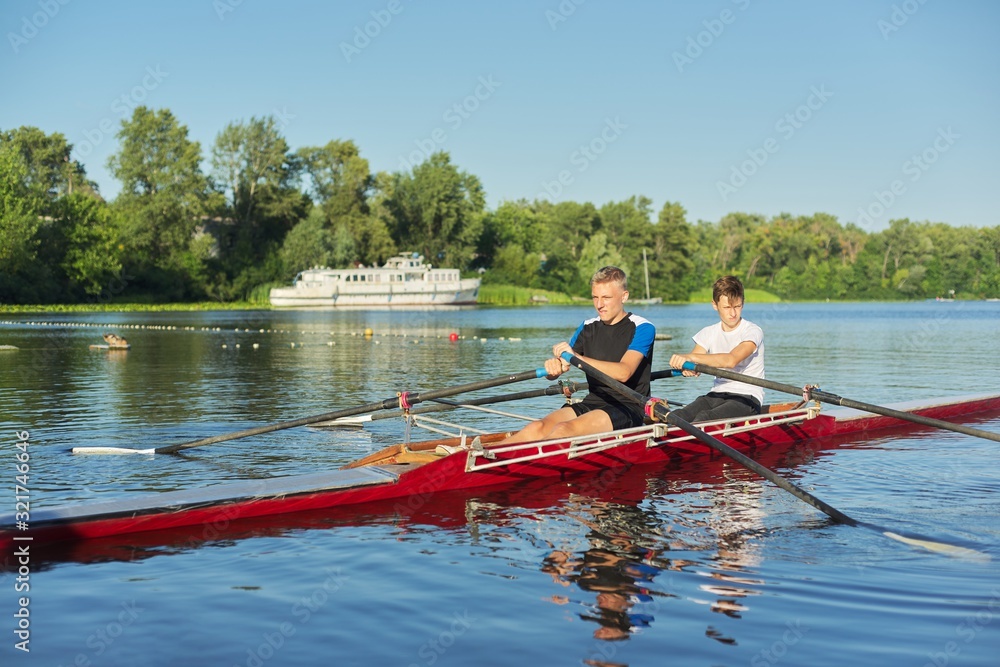 Active healthy lifestyle teens. Boys paddling sport kayak