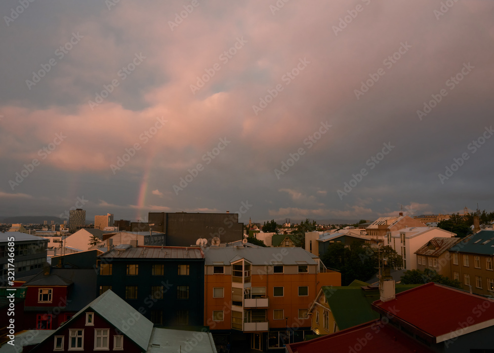 Cityscape over rekjavik with a rainbow