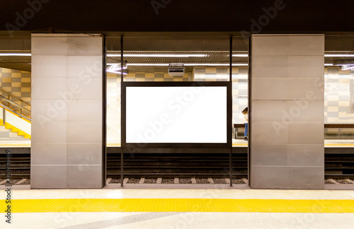 Blank billboard at the subway metro passenger station. Writing area for advertisement. Copy space