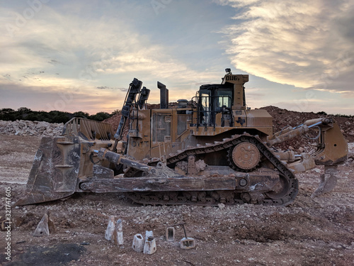Muddy Caterpillar D11 Bulldozer - Left Side View at Sunset