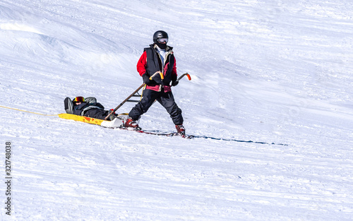 People are enjoying downhill skiing and snowboarding  © Yan