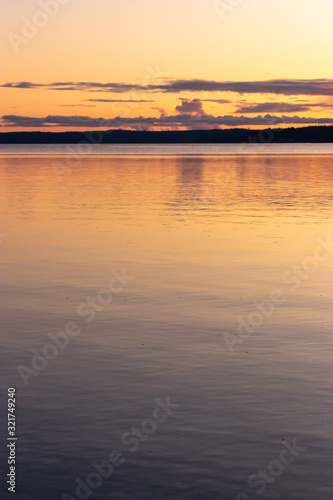 calm clean water of the puget sound with colorful sunset