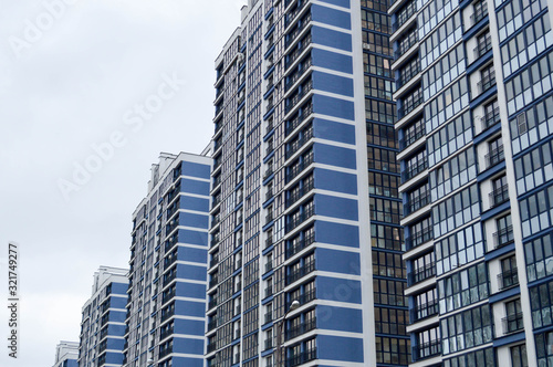 New modern tall blue glass multi-storey comfortable urban monolithic frame houses buildings skyscrapers new buildings in the big city of the megalopolis