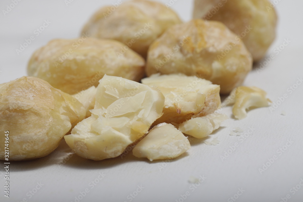 candlenut also known as kemiri at Indonesia, one of herbs that usually used for asian food as seasoning candlenut also known as kemiri at Indonesia, one of herbs that usually used for asian food as seasoning