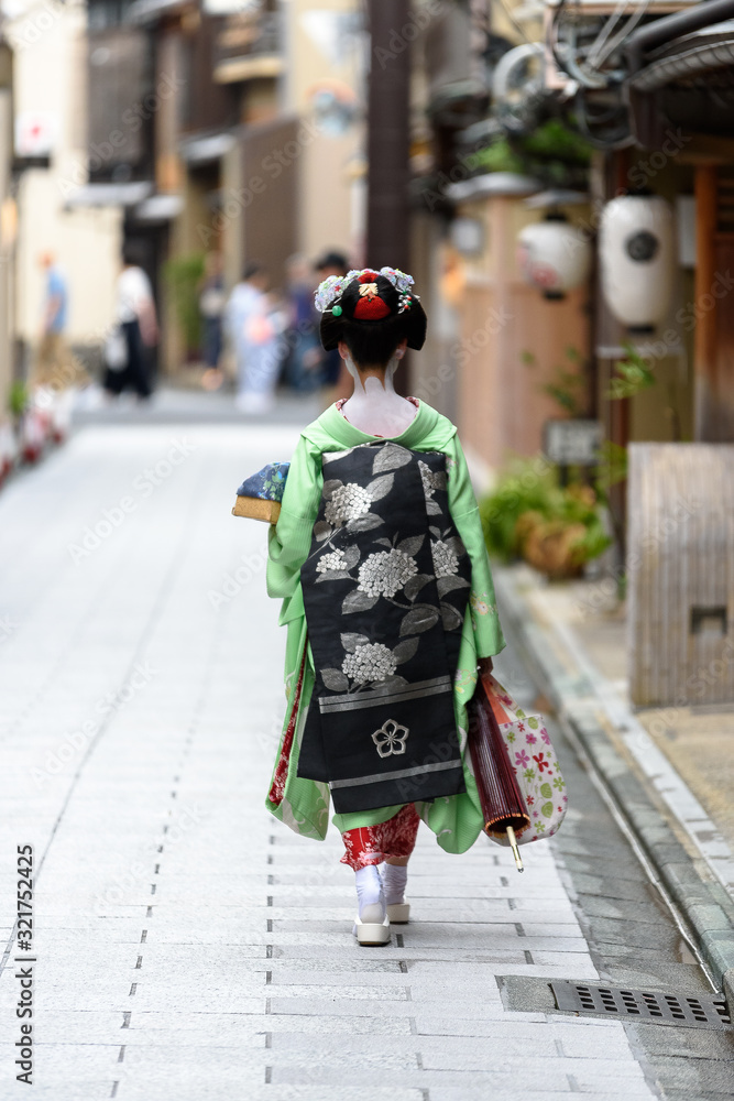 Geisha or maiko in the streets of Kyoto in Japan