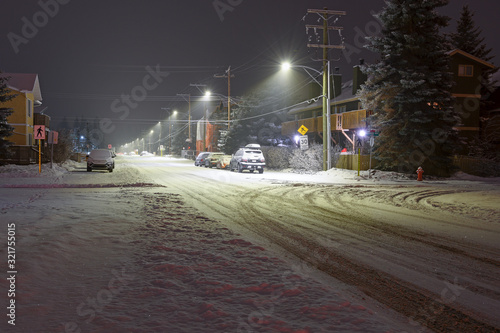 Snowy street in downtown Canmore, Alberta, Canada at night