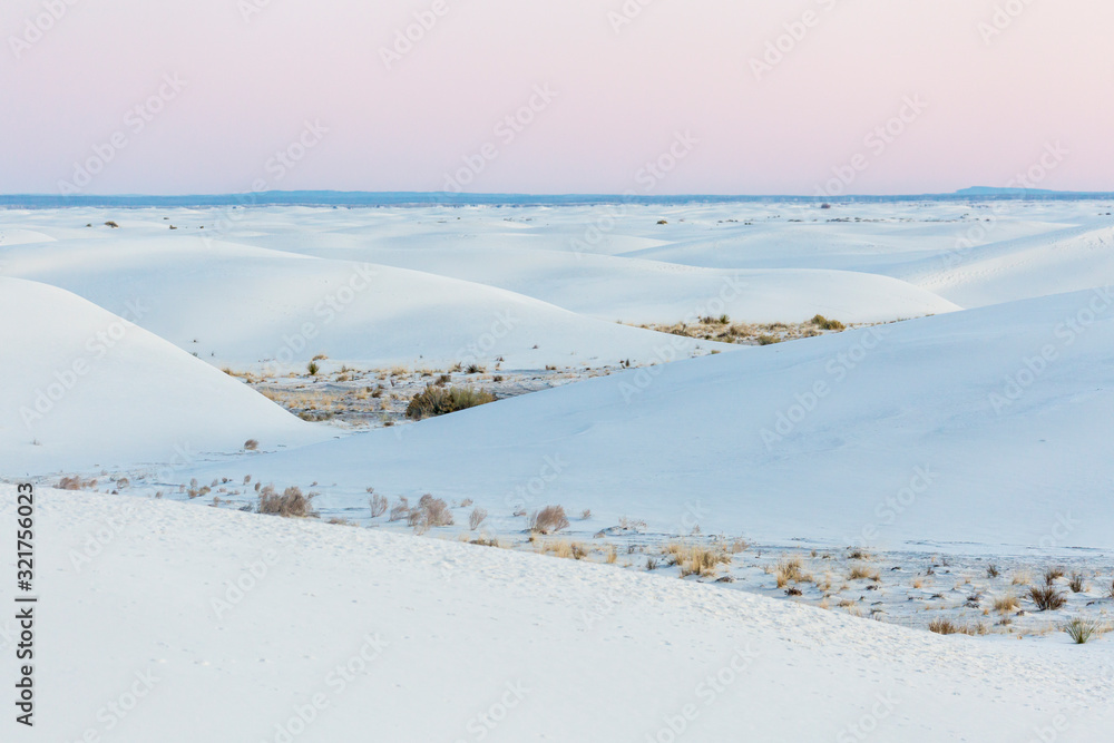 Landscape view of the sunrise in White Sands National Park near Alamogordo, New Mexico. Landscape view of the sunrise in White Sands National Park near Alamogordo, New Mexico.