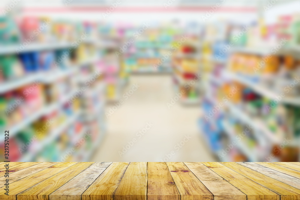 Shelf of Brown wood plank board with blurred super market background.