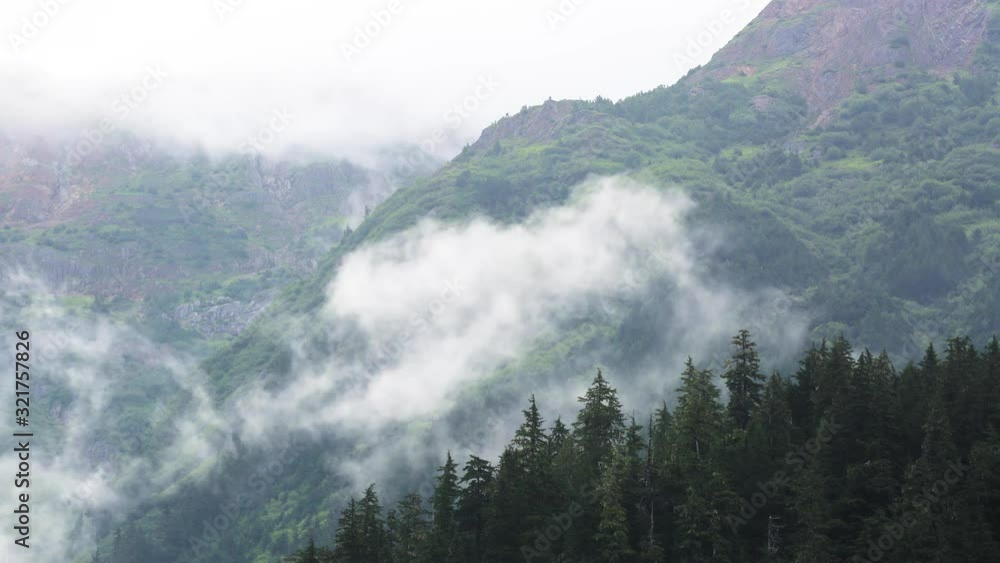 Alaska Alpine rocky mountains, fast clouds, and green pine forest. timelapse. Alaska Alpine rocky mountains, fast clouds, and green pine forest. timelapse.
