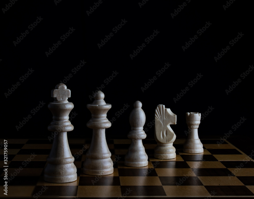 chess pieces on black background chess pieces on black background