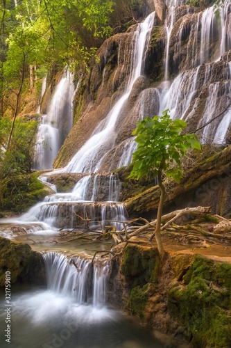 Vertical Landscape View of Scenic Kuang Si Falls  a beautiful cascading Waterfall in a Lush Forest Setting near Luang Prabang  Laos Southeast Asia
