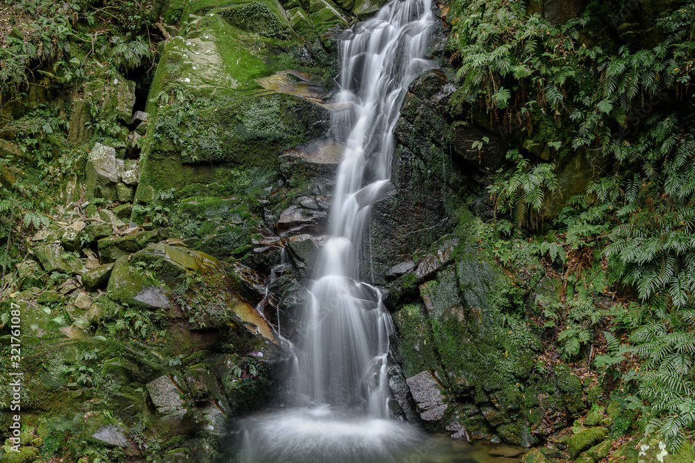Waterfall with stones covered by moss in a forest (Uguisu's falls in Nara, Japan) Waterfall with stones covered by moss in a forest (Uguisu's falls in Nara, Japan)