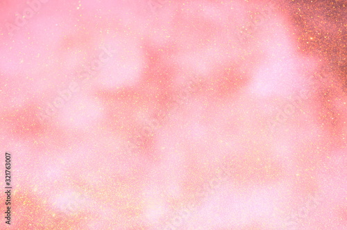 The abstract bokeh of bright glittering sheets that reflect sunlight.