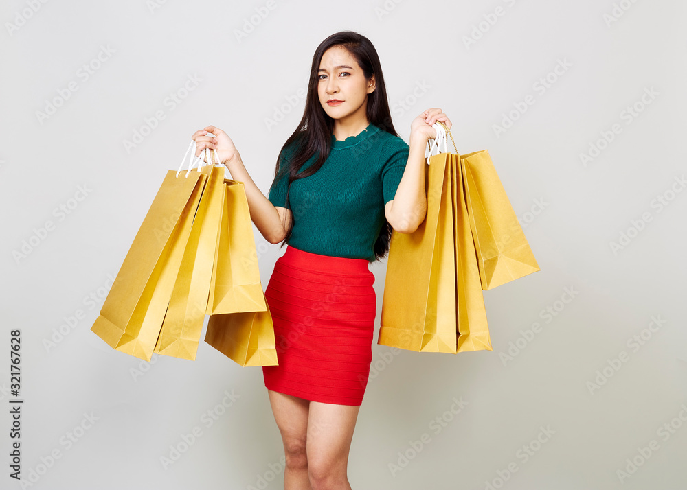 Smiling Young Woman Holding Shopping Bags