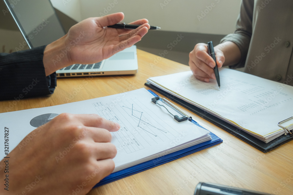 Bank employees sit and work and check the financial summary..Working in an office, a consultancy and a summary. Bank employees sit and work and check the financial summary..Working in an office, a consultancy and a summary.