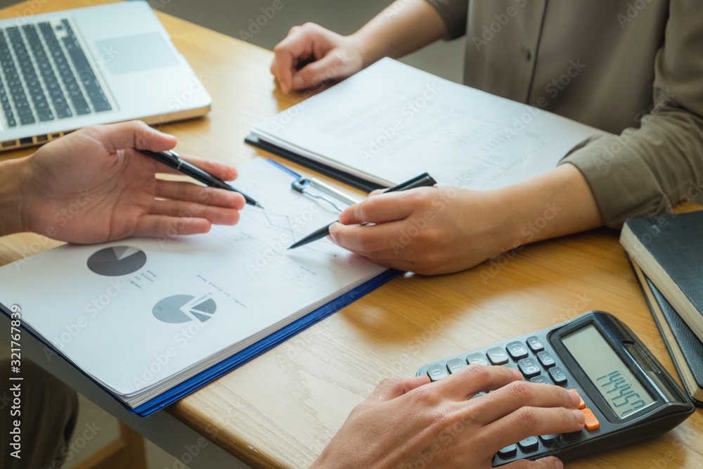 Bank employees sit and work and check the financial summary..Working in an office, a consultancy and a summary. Bank employees sit and work and check the financial summary..Working in an office, a consultancy and a summary.