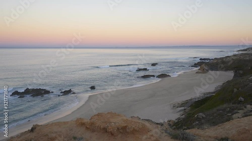 Praia do Malhao beach view at sunrise, in Portugal photo