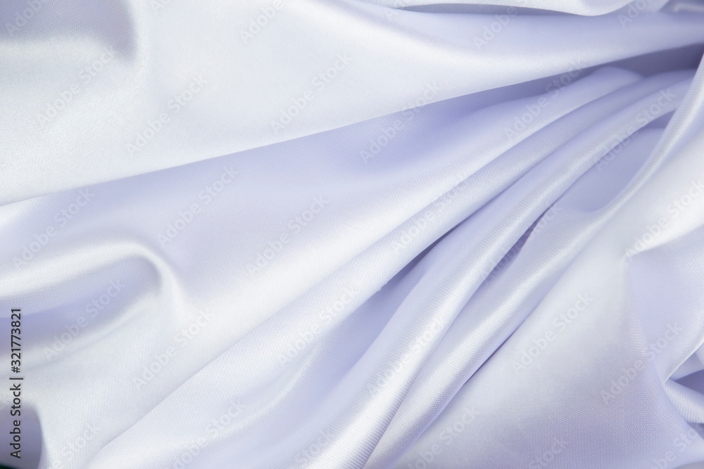 Naklejka premium White wrinkled fabric with wrinkles and waves, background and Wallpaper of crumpled tissue.
